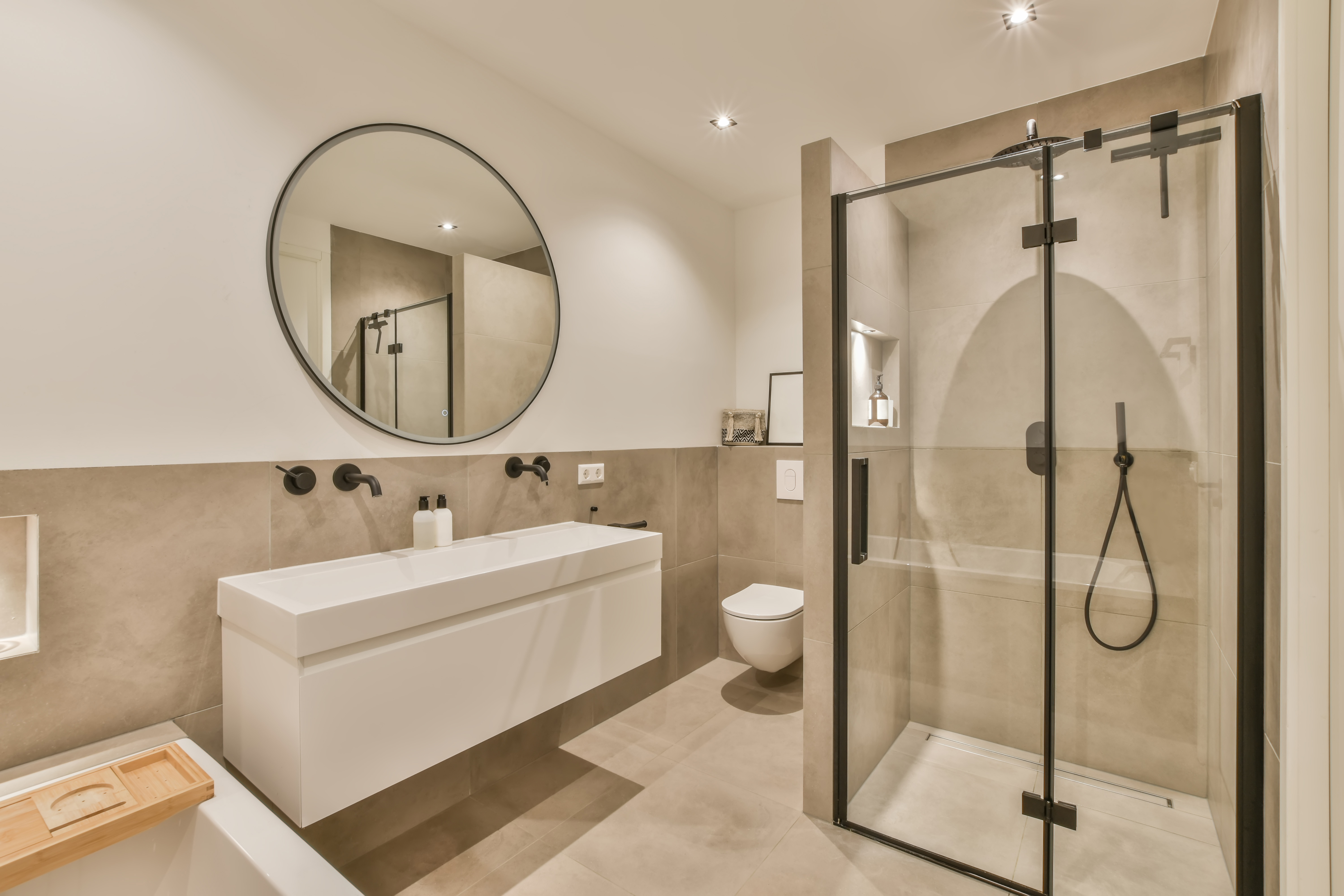 a-bathroom-with-a-shower-sink-and-a-mirror-2025-02-10-10-04-06-utc